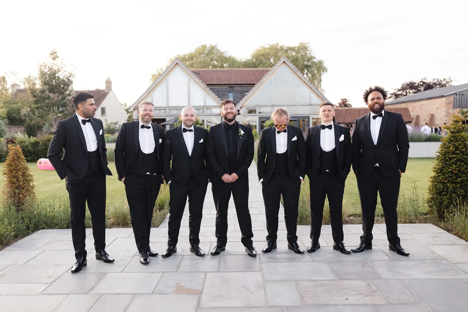The groom and his groomsmen lined up on the terrace