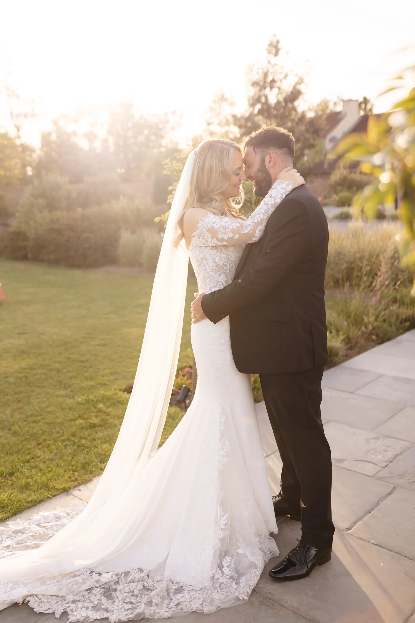 A couple sharing a kiss as the sun goes down