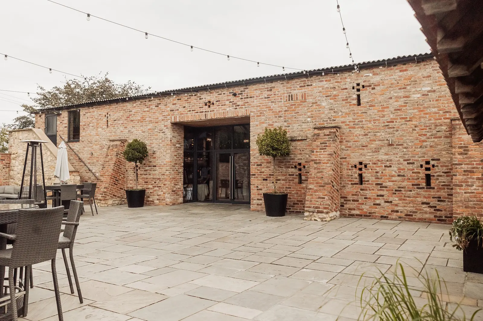 The courtyard by day, with the barn doors open