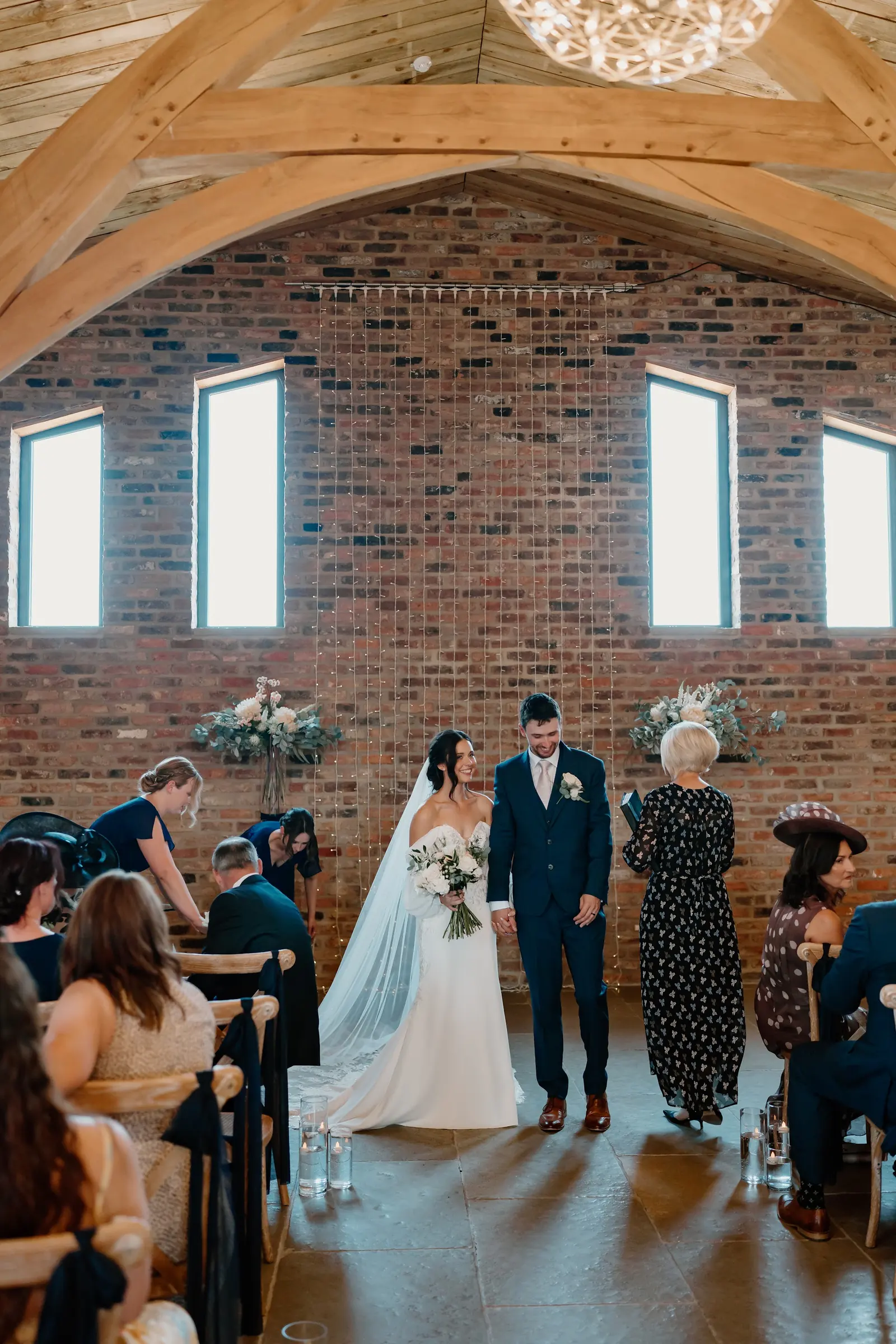A ceremony under the oak arches on a summer afternoon