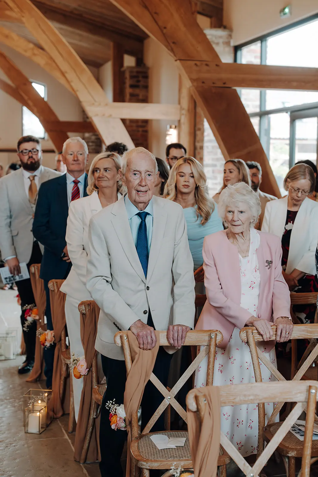 Guests turning to watch the aisle in the Ceremony Hall