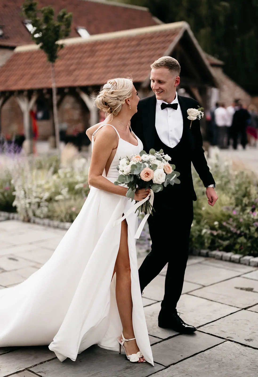 A couple walking across the courtyard